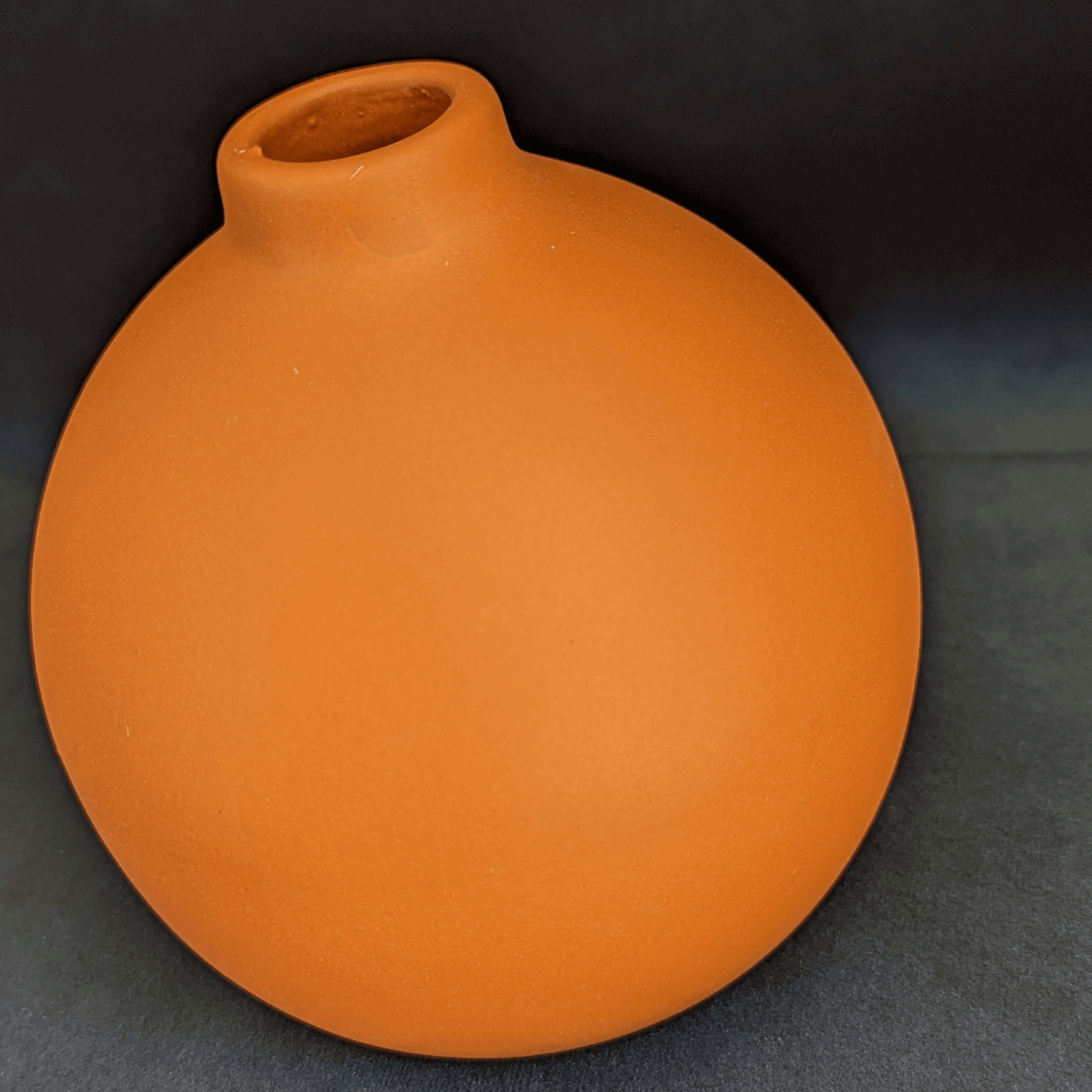 round orange home decor vase